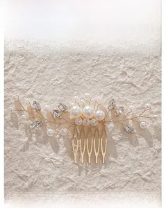 Detailed macro view of handmade bridal hair comb with pearls and rhinestones