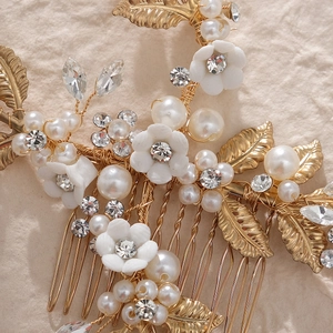 Bridal hair comb with white flowers, gold leaves, pearls and rhinestones for weddings