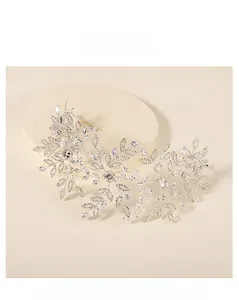Detailed view of silver bridal headband with crystal rhinestones and leafy vine design