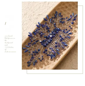 Detailed close-up of handmade bridal hair comb with blue crystals and silver wire vines