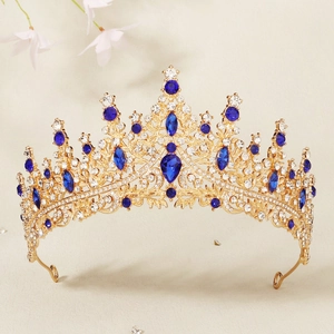 Close-up of luxury bridal crown with royal blue gemstones and gold alloy filigree