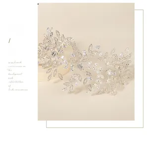 Close-up of luxury bridal headband featuring silver leaf design with clear rhinestones