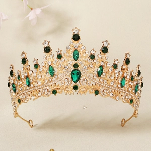 Luxurious bridal tiara crown with emerald green stones and sparkling white rhinestones