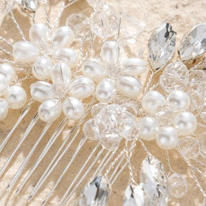 Elegant silver bridal hair comb with pearls and crystals for wedding hairstyles
