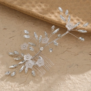 Elegant bridal hair comb with frosted white flowers and rhinestones on silver wire