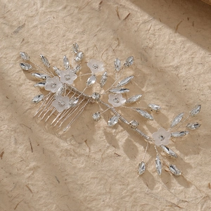 Elegant bridal hair comb with acrylic flowers and sparkling rhinestones for wedding hairstyles