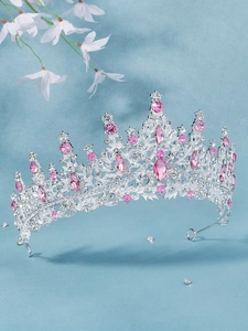 Detail of luxury bridal tiara with pink teardrop crystals and silver rhinestone setting