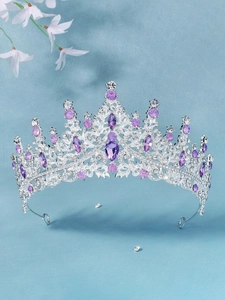 Macro detail of luxury bridal tiara with purple gemstones and silver rhinestone accents