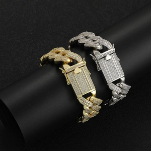 Iced-out 18mm Cuban link bracelets in 18k gold and silver with zircon insets