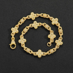 Iced out gold clover bracelet with pavé cubic zirconia and secure lobster clasp