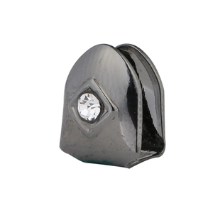 Detail view of hip-hop single tooth grillz in gunmetal black with a centered crystal stone
