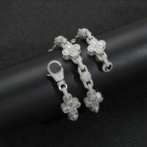 Macro shot of silver-tone clover link chain necklace with full zircon pavé settings