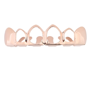 Vue détaillée de grillz ajourés plaqués or rose poli pour bijoux de dents hip-hop