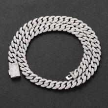 Detail of silver Cuban link necklace with iced out rhinestones and square safety clasp