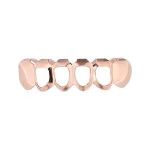 Détail des dents grillz hip hop plaquées or rose 18 carats avec cadre ajouré stylé