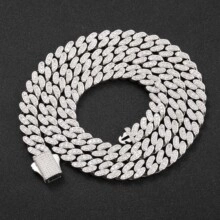 Close-up detail of silver Cuban link chain featuring micro-paved white zircons and square clasp