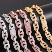 Detailed view of silver, rose gold and gold Cuban link chains with white zircon paving