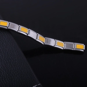 Men's stainless steel stretch bracelet with orange enamel links and industrial style