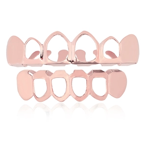 Ensemble grillz creux poli en or rose pour accessoires hip-hop sur fond blanc