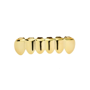 Hip hop style gold plated six-tooth grillz with mirror polished finish on white background