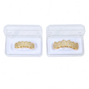 Hip hop gold teeth grillz with micro-pave cubic zirconia crystals in clear display cases