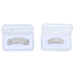 Detail of silver hip hop grillz set with micro zircon stones in plastic cases