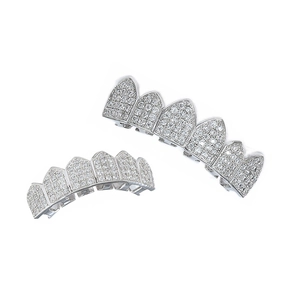 Macro detail of hip hop grillz set featuring silver finish with micro-pave cubic zirconia