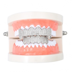 Detailed view of silver vampire fang grillz with micro-pave cubic zirconia stones