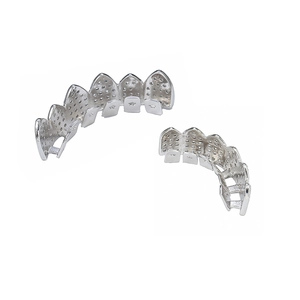 Detailed macro view of silver hip hop grillz set with micro paved zircon stones
