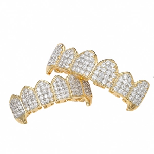 Detailed macro shot of gold plated hip hop grillz with micro-pave cubic zirconia stones