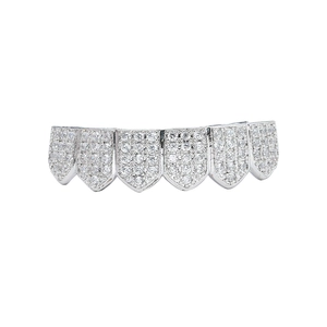 Macro detail of silver iced out hip hop grillz with shimmering pavé zircon stones