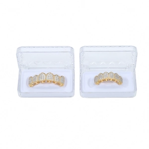 Macro detail of hip hop grillz set with pavé cubic zirconia in clear storage cases