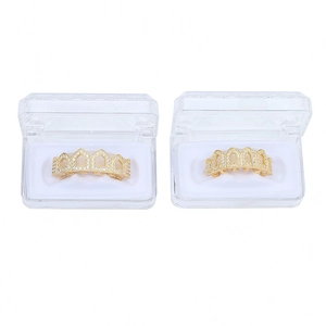 Ensemble grillz hip hop doré avec micro-pavage de zircons dans une boîte transparente