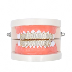 Detailed close-up of iced out gold plated hip hop grillz with micro-pave cubic zirconia