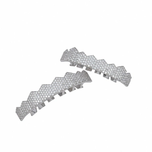 Close-up of iced out silver grillz set with micro paved zircon stones in hip hop style