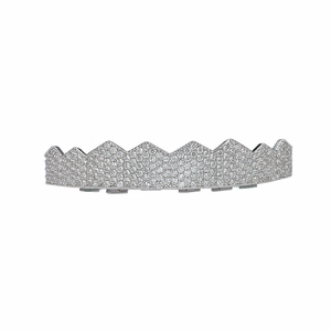 Macro detail of silver plated jagged grillz fully iced out with AAA cubic zirconia stones