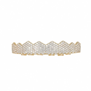 Macro view of hip hop gold grillz featuring micro-paved sparkling cubic zirconia stones
