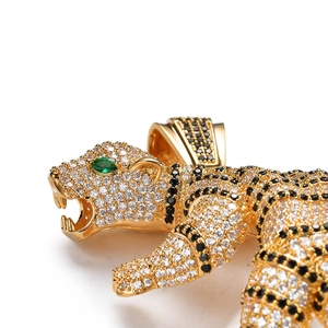 3D tiger pendant with cubic zirconia micro-paving and green agate eyes on a gold chain