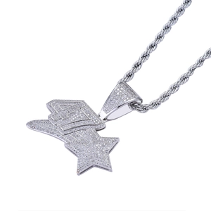 Macro detail of iced-out number 47 and star pendant with sparkling cubic zirconia
