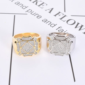 Detail view of gold and silver hip hop rings with sparkling cubic zirconia inlay