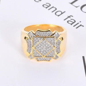 Macro detail of men's hip hop ring with gold plating and sparkling AAA cubic zirconia