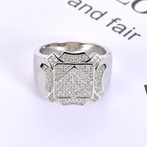 Detailed close-up of a silver-toned men's square ring paved with white cubic zirconia stones