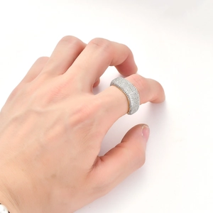 Close-up of hip hop square gold ring with cubic zirconia stones on hand