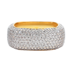 Macro detail of men's hip hop ring with full square zircon stones and gold inner band