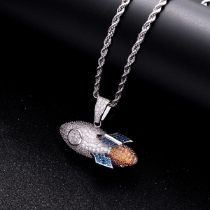 Macro detail of 925 silver rocket pendant featuring multi-color pavé cubic zirconia