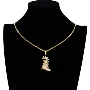Hip hop dinosaur pendant necklace with iced-out cubic zirconia on a gold twist chain