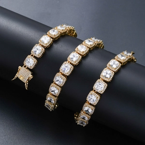 Close-up of gold hip hop bracelet with square cut zircons and pave box clasp detail