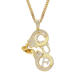 Iced-out gold handcuff pendant with CUF letters on a thick Cuban chain for men
