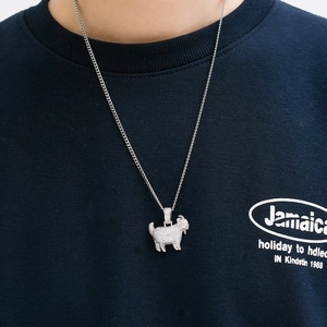 Detailed close-up of a silver hip hop goat pendant featuring pavé-set white zircons
