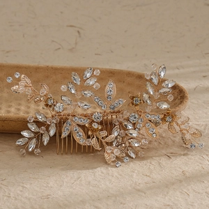 Elegant gold bridal hair comb with leaf pattern and sparkling rhinestones for wedding updos